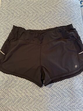 Athleta Black Women’s Running Shorts with Reflective Detail and zippered pockets